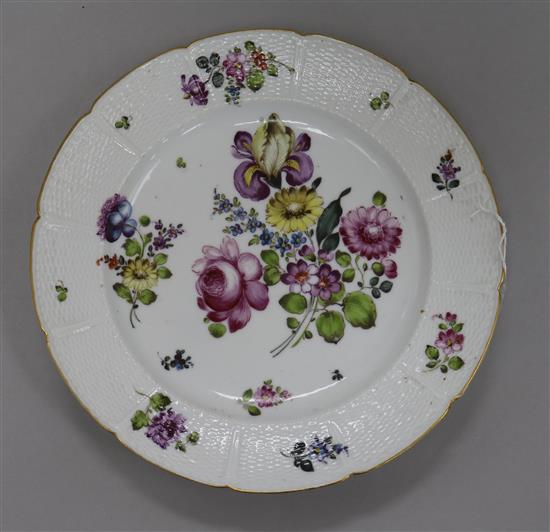 A German Meissen style dish, painted with floral bouquets